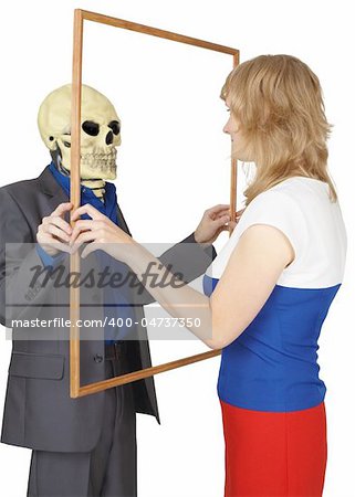 A woman looks at a skeleton as reflected