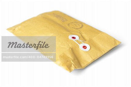 closed yellow mail parcel isolated on white background