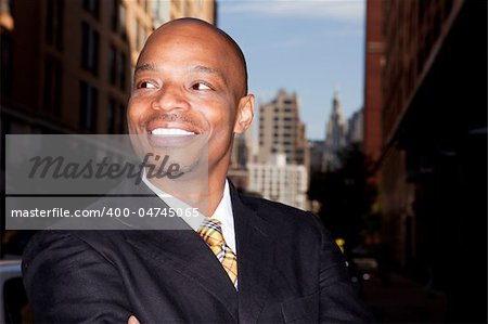 A business man isolated against a street background