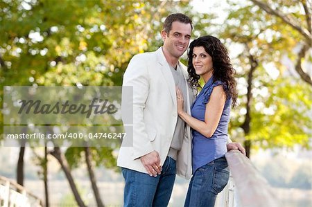 A couple looking at the camera and smiling