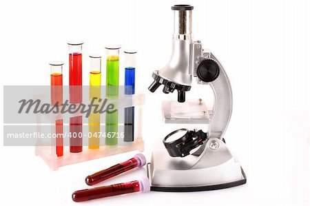 Laboratory metal microscope and test tubes with liquid isolated on white