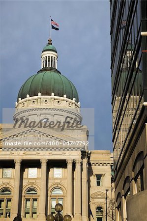 State Capitol of Indiana in Indianapolis reflected in the windows.