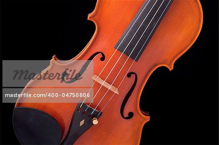 A professional professional violin viola isolated against a black background.