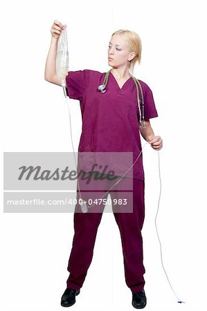 A beautiful young female doctor holding an IV bag