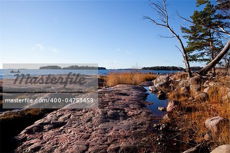 Rocky seashore in Helsinki, Finland. Beautiful autumn day.