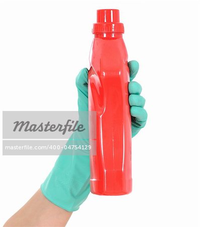 The hand in a green glove holds a red bottle