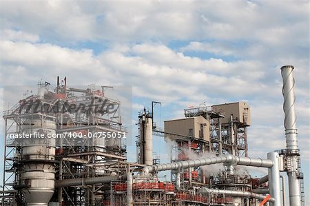 A petrochemical refinery plant with pipes and cooling towers.