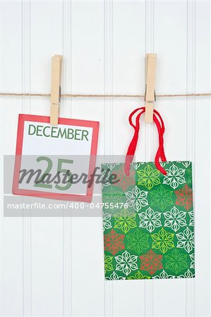 Gift Sack and Christmas Calendar Page on a Clothesline.  Holiday Concept.