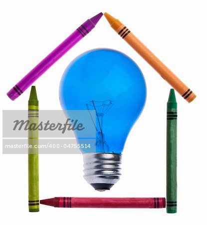 Vibrant Crayons in the Shape of a House with a Light Bulb for a Creative Home Concept.  Isolated on White with a Clipping Path.