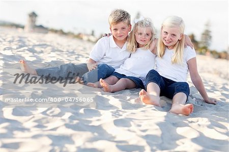 Adorable Sisters and Brother Having A Lot Fun at the Beach.