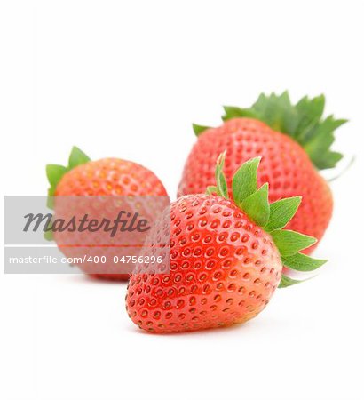 three strawberries on white background