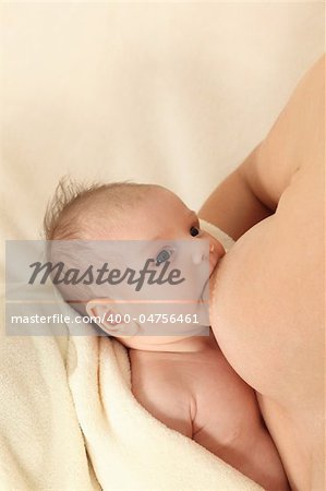 Mother breastfeeding her newborn baby