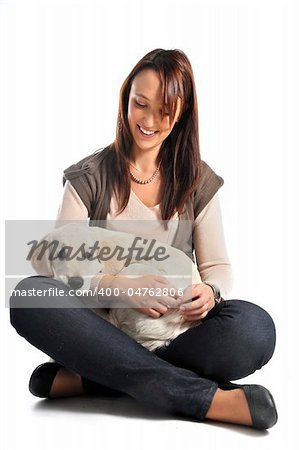 puppy golden retriever and woman in front of a white background