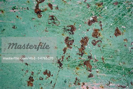 Texture of an  usty metal, painted in green color