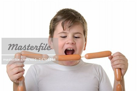 Boy with appetite bites sausages isolated in white