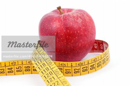 apple and measuring tape isolated on white background