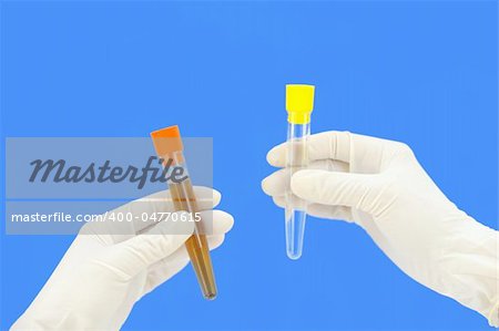 Clean and dirty water samples in hands