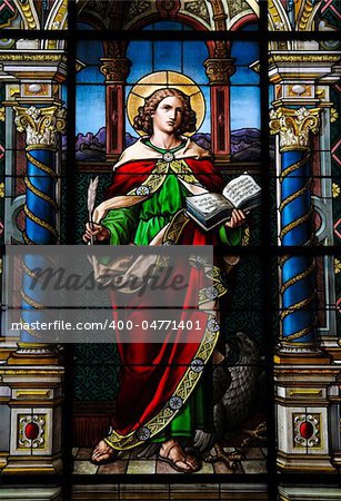 Saint John the Evangelist. Stained glass window created by F. Zettler (1878-1911) at the German Church (St. Gertrude's church) in Gamla Stan, Stockholm.