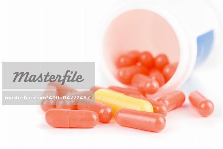 Red and yellow pills isolated on a white background