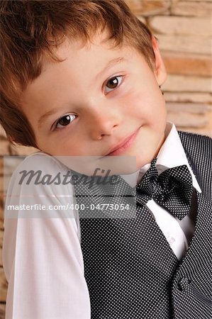 cute boy in a suit and bow tie