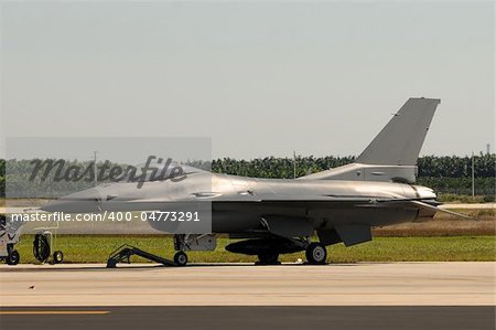 Air Force jetfighter parked on the ground side view