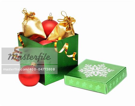 christmas baubles in gift box on white