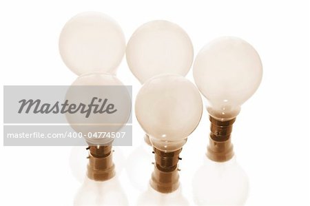 Light Bulbs in Warm Tone on White Background