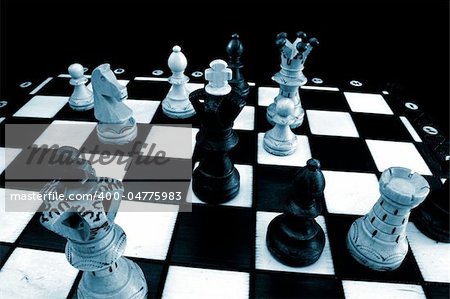 chess pieces on chess board showing competition success and strategy in business