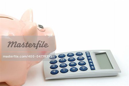 piggy bank and calculator showing saving concept