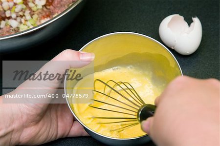 Beating eggs for use in meatloaf recipe