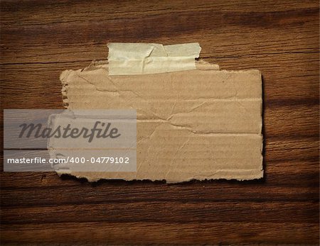 close up of grunge note paper on wooden background