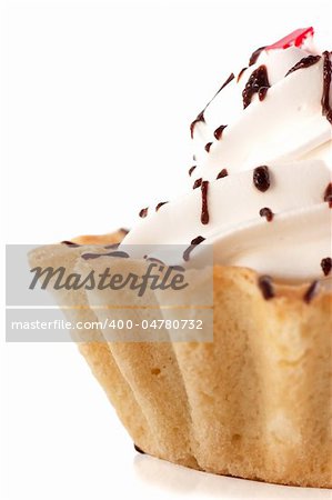 Macro view of cake with whipped cream isolated over white