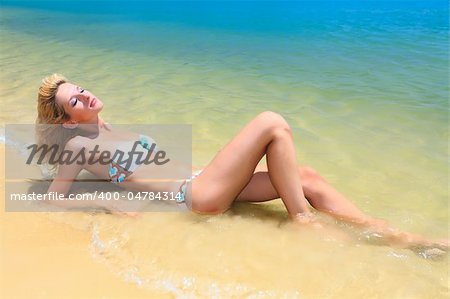 Beautiful woman in bikini on the beach