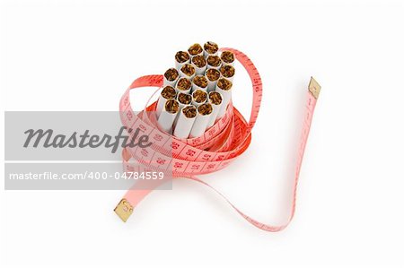 Smoking concept with measuring tape and cigarettes