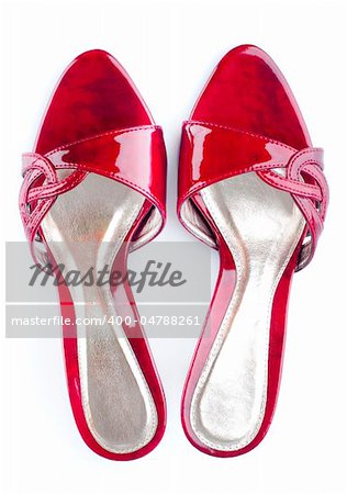 Pair of high heel red female shoes isolated on white background.