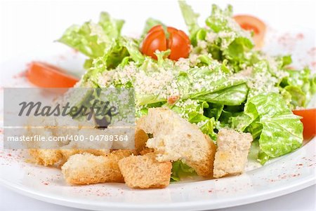 Caesar salad dish closeup isolated on a white background