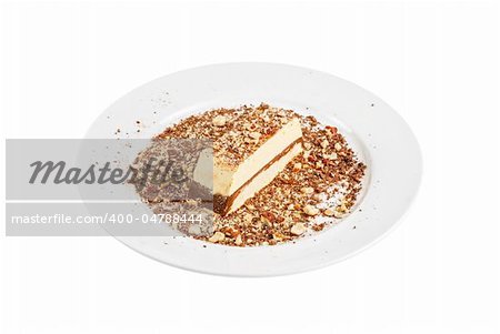 Slice of chocolate cake with nuts isolated on white