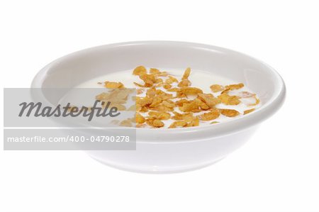 Bowl with corn flakes and milk, photo on white