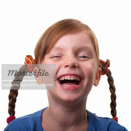 Funny smiling little girl portrait isolated over white background