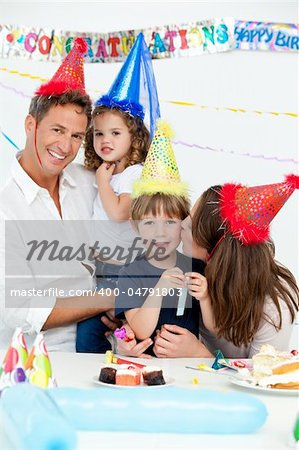 Portrait of a happy family during a birthday party at home
