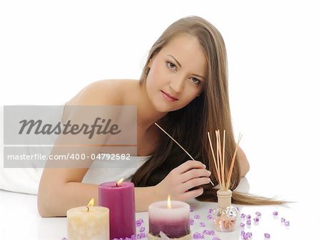 Aromatherapy.Beautiful woman with pure healthy skin and long hair in spa salon relaxing. isolated on white background