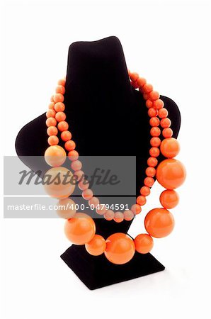 Orange color necklace on black Mannequin