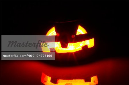 Halloween's orange pumpkin photo on the black background