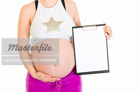 Pregnant woman holding blank clipboard isolated on white.  Closeup.