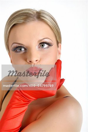 Young elegant beauty female face with red shiny lips and black eye makeup. colse-up.