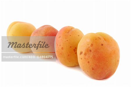 Apricot fruits combined by mountain on a white background.