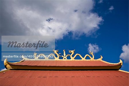 Golden dragon statue on the roof In Thailand
