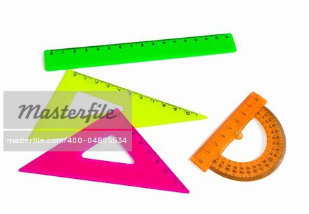 Colored plastic drafting tools - triangles,ruler, protractor isolated on white