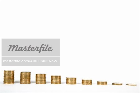 Columns of golden coins arranged in staircase shape, isolated on white background