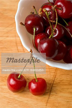 ripe cherries on the wood table